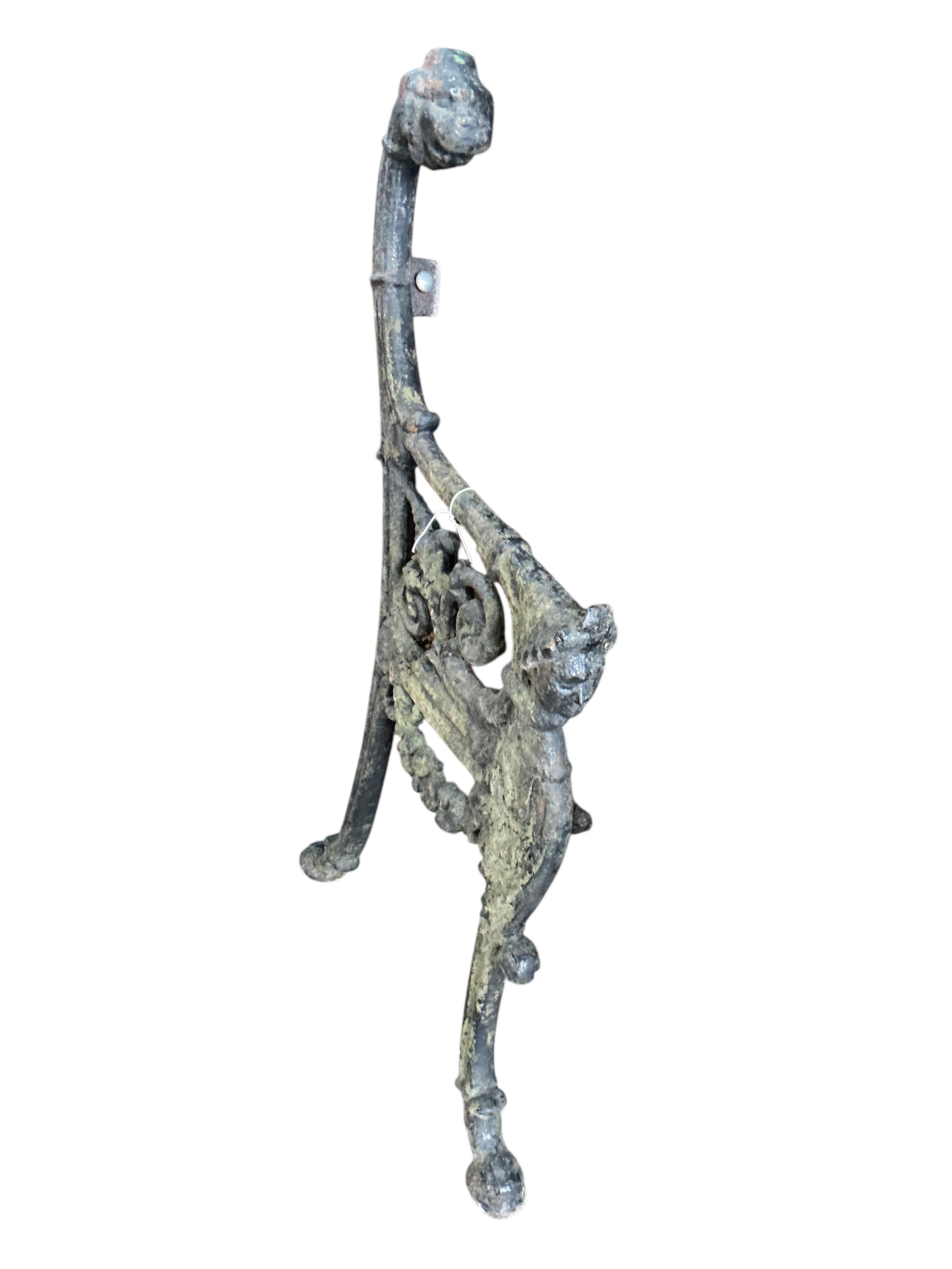 A pair of Victorian cast iron leopard's head bench ends, height 94cm